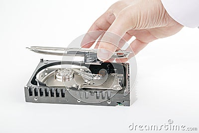 Hand repairman opens the top cover of the 3.5 inch HDD. Stock Photo