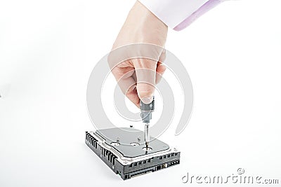 Hand repairman unscrews the 3.5 inch hard drive cover with a screwdriver. Stock Photo