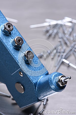 Hand rivet tool on metal surface Stock Photo