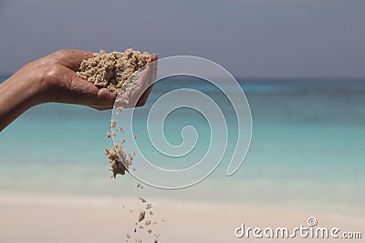 Hand with sand Stock Photo