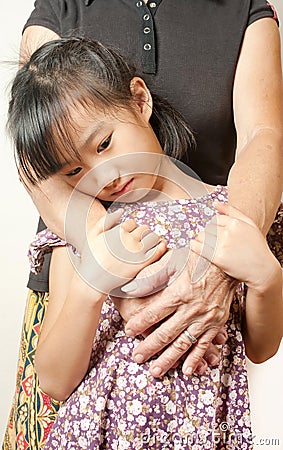 Hand of senior hugging with her child. Asian llttle girl embrace Stock Photo