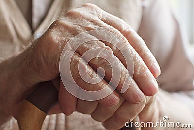 Hand of a senior man with a cane Stock Photo