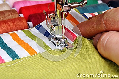 Hand sewing on a machine Stock Photo