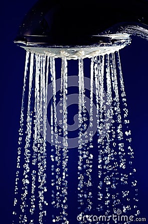 Hand shower douche with stopped motion water drops Stock Photo