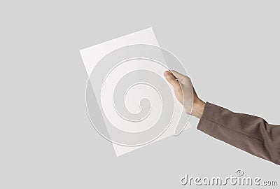 Hand showing blank paper A4 flyer for mockup template logo branding on grey background Stock Photo