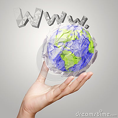 Hand showing crumpled world paper Stock Photo