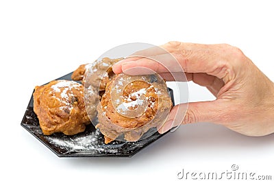 Hand showing dutch oliebol or fritter Stock Photo