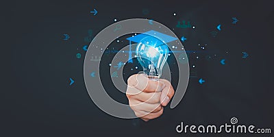 Hand showing graduation hat icon in light bulb. E-learning graduate certificate program concept Stock Photo