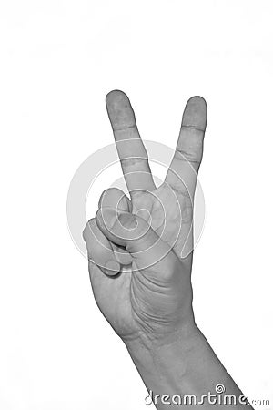 Hand showing peacy victory sign against pure. black and white Stock Photo