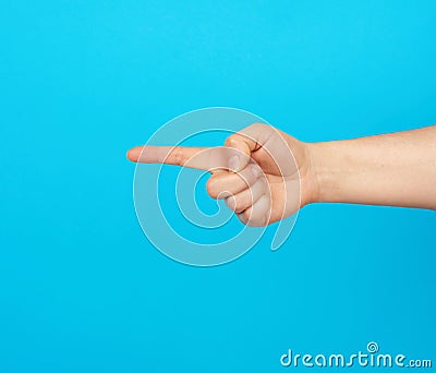 Hand shows forefinger gesture on a blue background Stock Photo