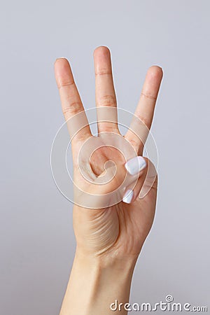 The hand shows the number three. Countdown gesture or sign. Sign language Stock Photo