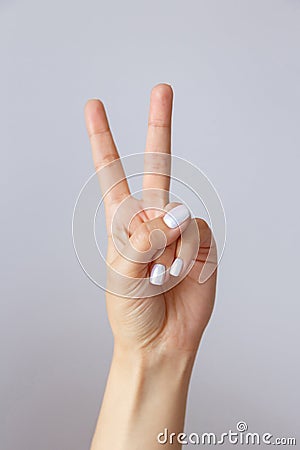 The hand shows the number two. Countdown gesture or sign. Sign language Stock Photo