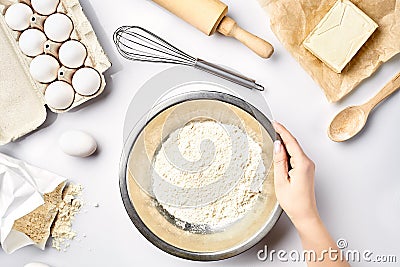 Hand sift flour. Bakery prepare for make cake. Top view Stock Photo