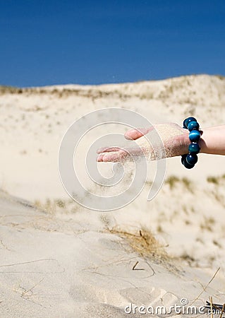 Hand Sifting Sand Stock Photo