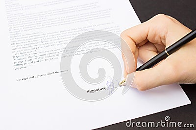 Hand signing a contract Stock Photo