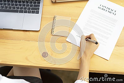 Hand are signing insurance contract. Stock Photo