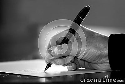 Hand Signing Paperwork/Contract (Black & White) Stock Photo