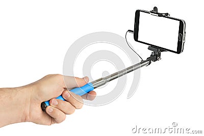 Hand and smartphone with selfie stick Stock Photo