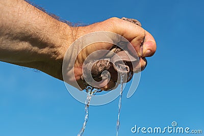 Hand squeeze cloth. Stock Photo