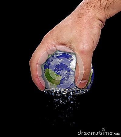 Hand squeeze earth Stock Photo