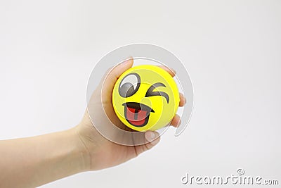 Hand squeezing the stress ball Stock Photo