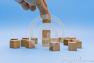 Hand Stacking Wooden Block Stock Photo