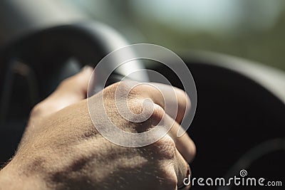 Hand on a Steering Wheel Stock Photo