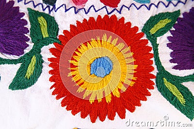 Hand stitched fabric with a colourful flower Stock Photo