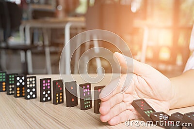 hand stop continuous toppled, prevent domino effect. risk, failure solution & strategy in business. Stock Photo