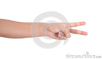 A hand stretched out in front of a white background to make a scissors hand gesture Stock Photo