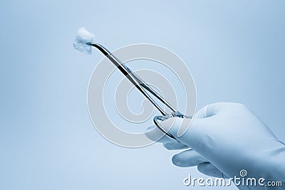 Hand of surgeon with forceps Stock Photo