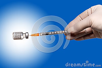 Hand with syringe of Pfizer vaccine Editorial Stock Photo