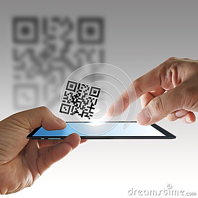 Hand and tablet computer scan Qr code Stock Photo