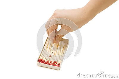 Hand takes out a match from a matchbox Stock Photo