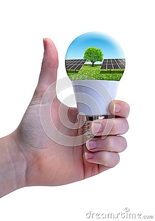 Hand with thumb up holding eco LED bulb with solar panel isolated on a white background. Stock Photo