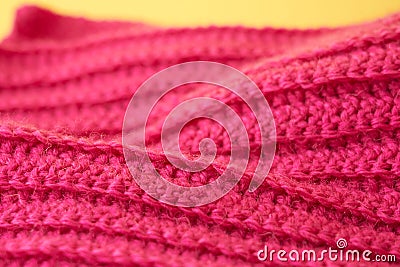 The hand-tied magenta-colored knitted canvas is like a background. Stock Photo
