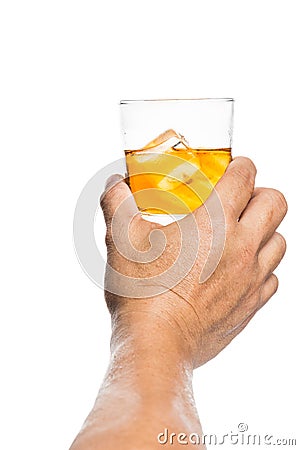 Hand toasting a glass of whiskey on the rocks Stock Photo