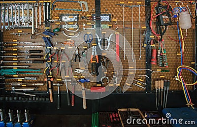 Hand tool kit object arrangement on car auto service and maintenance wall Stock Photo