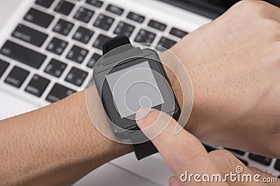 Hand touching screen smart watch technology gadget Stock Photo