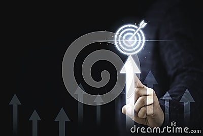 Hand touching up arrow with virtual target board for enhance and set up business objective target goal concept Stock Photo