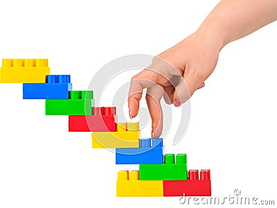 Hand and toy stairs Stock Photo