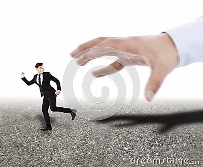 hand trying to catch running businessman Stock Photo