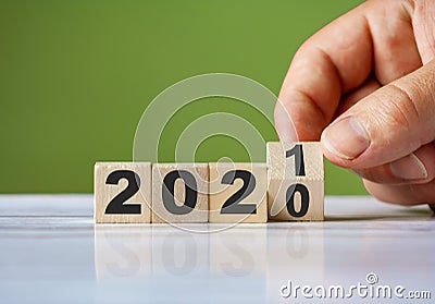 Hand turn wooden blocks for change year 2020 to 2021 . New year concept Stock Photo