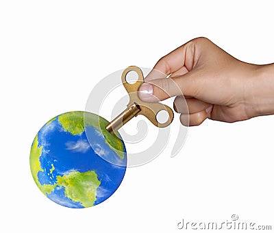 Hand turning mechanic handle to recharge the planet earth on powering planet concept. Stock Photo