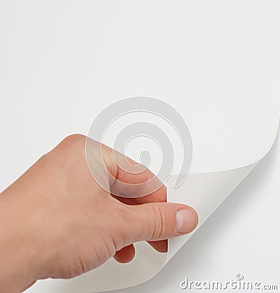 Hand turning page Stock Photo