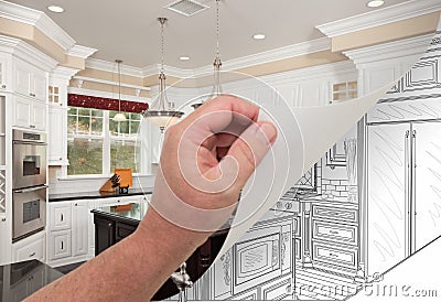 Hand Turning Page of Custom Kitchen Photograph to Drawing Stock Photo