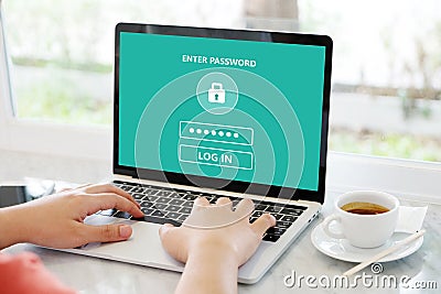 Hand tying laptop computer with password login on screen, cyber Stock Photo