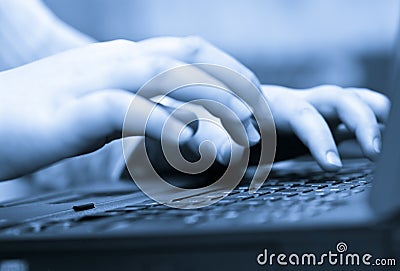 Hand typing on keyboard Stock Photo