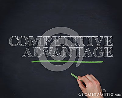 Hand underlining the word competitive advantage in green Stock Photo