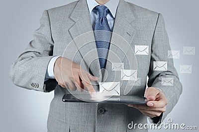 Hand use tablet computer with email icon Stock Photo